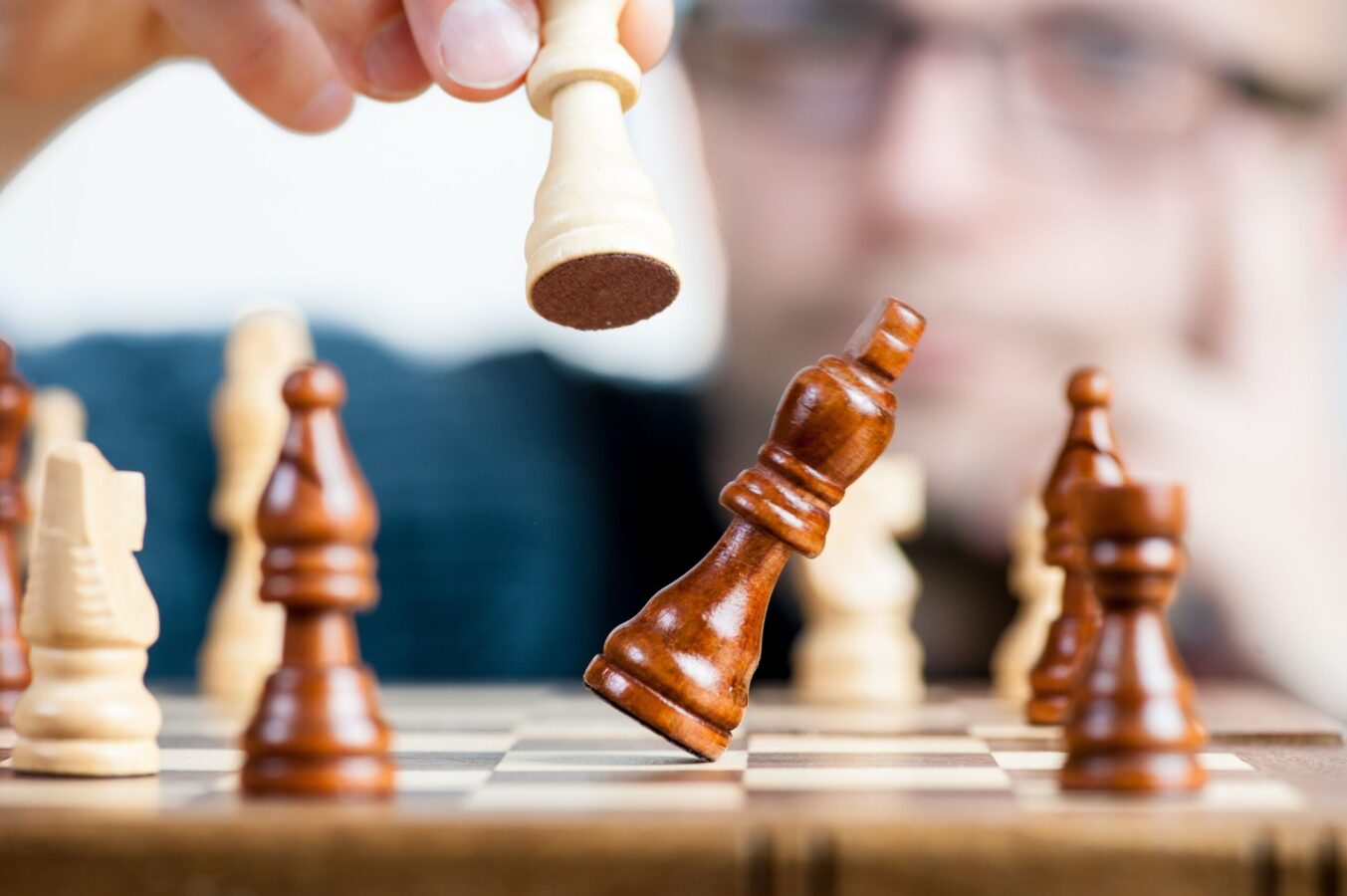 Man holding chess piece